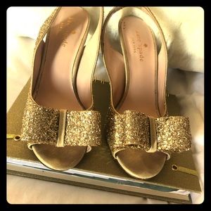 Kate Spade Gold glitter sling back pumps.